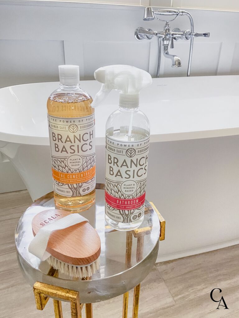 Bottles of Branch Basics natural cleaners in a bathroom.