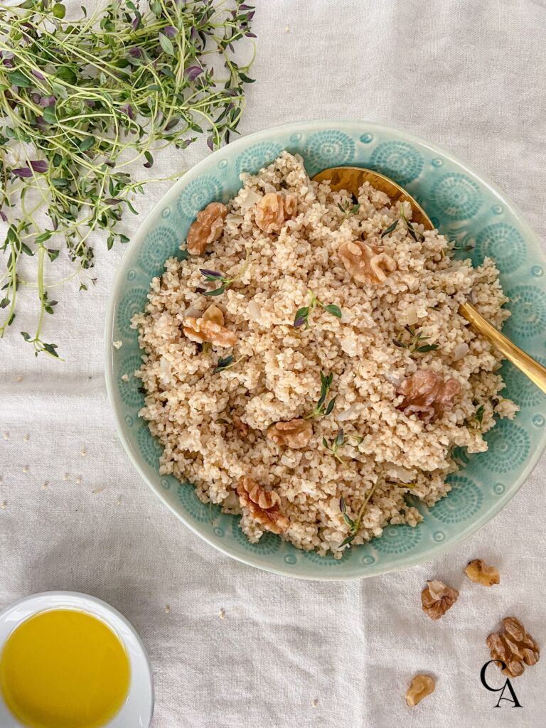 A bowl of food in a turquoise bowl.