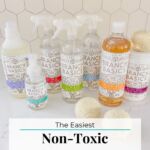 Bottles of household cleaners on a white countertop.