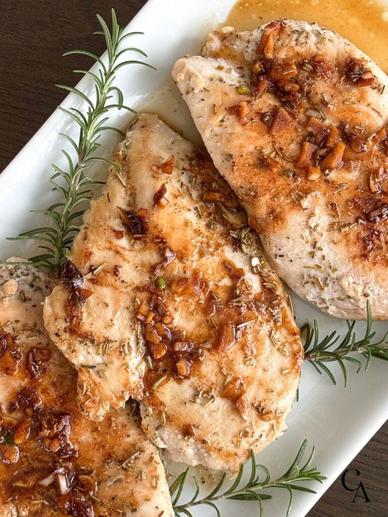 Cooked chicken tenders with herbs.