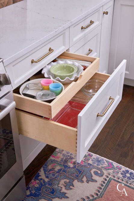 Kitchen drawers with baking items organized inside.