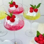 Homemade jello with berries and cream.
