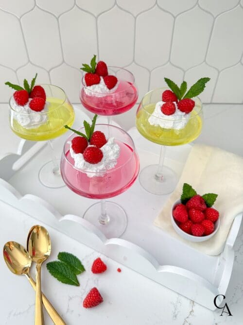 Pink and yellow sugar-free jello with berries and mint leaves.