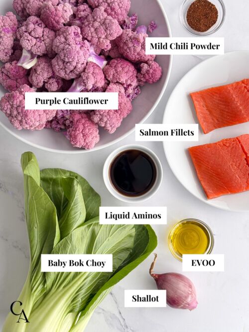 Various bowls of ingredients to cook a salmon and purple cauliflower dinner recipe.