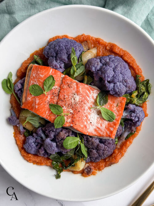 Bowls of salmon and steamed vegetables with jasmine rice.