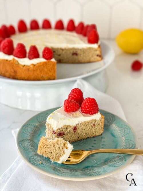 A slice of cake on a turquoise plate.