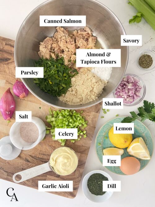 Bowls of ingredients on a wooden cutting board.