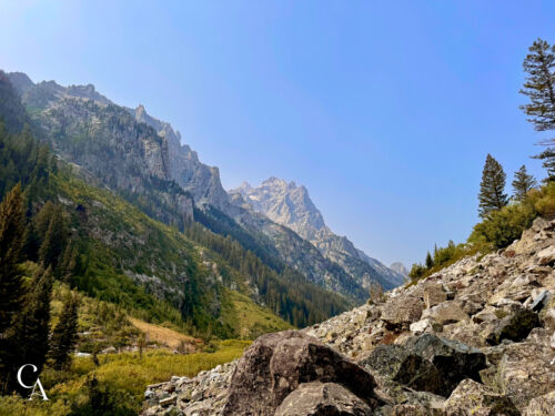 Cascade Canyon in Grand Teton National Park, with mountains on one side and a boulder field on the other.