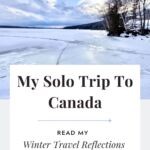 A winter landscape with a frozen lake in the background with text overlay that reads, "My Solo Trip to Canada."