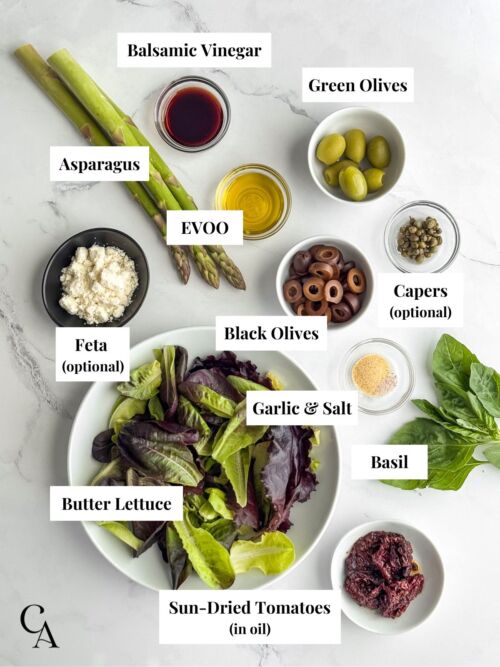 Small bowls of ingredients on a marble surface.