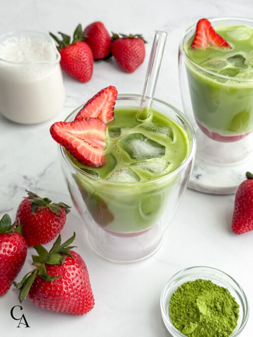 Looking down on an iced matcha with strawberries.